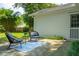 Back patio features a seating area with comfortable chairs and a blue rug at 8 Tovey Rd, Charleston, SC 29407