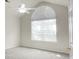 Bright bedroom with vaulted ceiling, large arched window with blinds, ceiling fan, and neutral carpet at 8800 Dorchester Rd # 2004, North Charleston, SC 29420