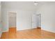 Bedroom featuring hardwood floors, walk-in closet, and white walls at 8800 Dorchester Rd # 2004, North Charleston, SC 29420