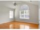 Bright bedroom with hardwood floors, ceiling fan and natural light from large windows at 8800 Dorchester Rd # 2004, North Charleston, SC 29420