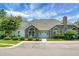Community clubhouse with a stone facade, large arched windows, and accessible parking at 8800 Dorchester Rd # 2004, North Charleston, SC 29420