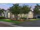 Charming single-story home featuring stone accents, manicured lawn, and mature trees at 8800 Dorchester Rd # 2004, North Charleston, SC 29420