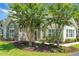 Lovely home with stone details, a welcoming front porch, and pretty landscaping at 8800 Dorchester Rd # 2004, North Charleston, SC 29420