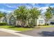 Beautiful home with stone accents, manicured lawn, mature trees, and an inviting facade at 8800 Dorchester Rd # 2004, North Charleston, SC 29420