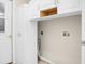 White cabinets and washer dryer hookups in the laundry room at 8800 Dorchester Rd # 2004, North Charleston, SC 29420