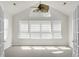 Bright sunroom with vaulted ceilings, large windows, and neutral carpet at 8800 Dorchester Rd # 2004, North Charleston, SC 29420