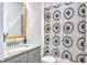 Stylish bathroom with granite vanity, modern fixtures, and a shower with a patterned curtain at 914 Dill Ave, Charleston, SC 29412