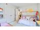 Bright, playful bedroom features a charming bed frame and closet space at 914 Dill Ave, Charleston, SC 29412