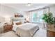 Inviting bedroom featuring a large window, neutral tones, and comfortable bedding at 914 Dill Ave, Charleston, SC 29412