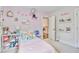 Cozy bedroom with playful decor, pastel accents, and an adorable neon name sign at 914 Dill Ave, Charleston, SC 29412