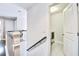 Hallway view to laundry room with tile flooring and stainless steel washer and dryer at 914 Dill Ave, Charleston, SC 29412