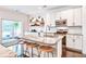 Modern kitchen with granite countertops, stainless steel appliances, and sliding door to patio at 914 Dill Ave, Charleston, SC 29412