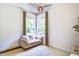 Cozy sitting area with a comfortable loveseat, stylish light fixture and natural light at 914 Dill Ave, Charleston, SC 29412