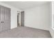 Clean, carpeted bedroom with double closets, ample natural light, and neutral tones for a restful atmosphere at 1009 Field Sparrow Dr # Cc3-2-6, Ravenel, SC 29470