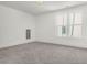 Bright, carpeted bedroom with ample natural light through large windows, creating an inviting space at 1009 Field Sparrow Dr # Cc3-2-6, Ravenel, SC 29470