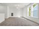 Bright, carpeted bedroom with ample natural light through large windows, creating an inviting space at 1009 Field Sparrow Dr # Cc3-2-6, Ravenel, SC 29470