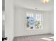Bright, neutral bedroom featuring a large window with neighborhood views, offering a serene and airy space at 1009 Field Sparrow Dr # Cc3-2-6, Ravenel, SC 29470