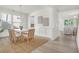 Bright dining room with a modern table, woven chairs, and natural light, ideal for gatherings at 1009 Field Sparrow Dr # Cc3-2-6, Ravenel, SC 29470