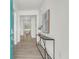 Bright entryway with light wood floors, a modern console table, and stylish decor for a welcoming ambiance at 1009 Field Sparrow Dr # Cc3-2-6, Ravenel, SC 29470