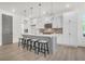 Bright kitchen features large island with seating, stainless appliances, pendant lights, and neutral color palette at 1009 Field Sparrow Dr # Cc3-2-6, Ravenel, SC 29470