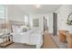 Bright main bedroom with natural light, a king bed, and stylish side table at 1009 Field Sparrow Dr # Cc3-2-6, Ravenel, SC 29470