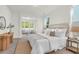 Bright main bedroom with natural light, a king bed, and an adjoining seating area at 1009 Field Sparrow Dr # Cc3-2-6, Ravenel, SC 29470