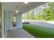 Covered patio featuring a ceiling fan, and a view of the spacious green backyard and natural surroundings at 1009 Field Sparrow Dr # Cc3-2-6, Ravenel, SC 29470