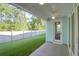 Covered patio featuring a ceiling fan, and a view of the spacious green backyard and natural surroundings at 1009 Field Sparrow Dr # Cc3-2-6, Ravenel, SC 29470