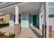 Cozy front porch with brick-based columns and a vibrant turquoise door, perfect for welcoming guests at 1009 Field Sparrow Dr # Cc3-2-6, Ravenel, SC 29470