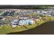 An aerial view of a Primary-planned community featuring a resort-style pool, clubhouse, and numerous single-Gathering homes at 105 Philips Park St, Summerville, SC 29486