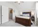 Comfortable bedroom with a large bed, two side tables, and an open doorway to a potential closet at 105 Philips Park St, Summerville, SC 29486