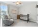 Charming Bedroom with a black crib, rocking chair, and soft decor, creating a soothing environment at 105 Philips Park St, Summerville, SC 29486