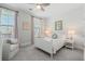 Cozy bedroom with soft natural light, a comfortable armchair, and neutral decor for a serene atmosphere at 105 Philips Park St, Summerville, SC 29486