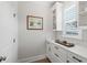 Butler's pantry with white cabinetry, quartz countertop, and a window for natural light at 105 Philips Park St, Summerville, SC 29486