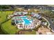 Aerial view of resort-style pool featuring a water slide, palm trees, and lounge areas at 105 Philips Park St, Summerville, SC 29486
