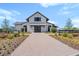 Charming community farmhouse with landscaped grounds and inviting entrance at 105 Philips Park St, Summerville, SC 29486