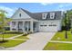 Beautiful light blue two-story home with a two-car garage and well-manicured lawn at 105 Philips Park St, Summerville, SC 29486