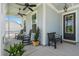 Inviting front porch with rocking chairs, a bench, and views of the neighborhood at 105 Philips Park St, Summerville, SC 29486