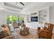 Comfortable living room with stylish furniture, ceiling fan, and access to outdoor space at 105 Philips Park St, Summerville, SC 29486