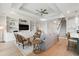 Open living space with built-ins, comfortable seating, and seamless flow to the kitchen at 105 Philips Park St, Summerville, SC 29486