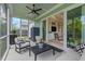 Inviting screened patio featuring comfortable seating and access to the backyard at 105 Philips Park St, Summerville, SC 29486