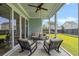 Cozy screened patio with a comfortable seating area and views of the green yard at 105 Philips Park St, Summerville, SC 29486