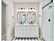 Bathroom featuring double vanity, sleek mirrors, and glass-enclosed shower at 1052 Yorktown Dr, Charleston, SC 29412