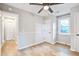 Bright bedroom with wood floors, ceiling fan, and two closets at 1052 Yorktown Dr, Charleston, SC 29412