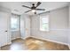 Spacious bedroom with wood flooring, ceiling fan, and two windows at 1052 Yorktown Dr, Charleston, SC 29412