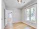 Bright bedroom with hardwood floors, large window with great view, and doorway to another room at 1052 Yorktown Dr, Charleston, SC 29412