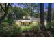 Inviting exterior of a home with a well-manicured lawn and lush landscaping provides privacy at 1052 Yorktown Dr, Charleston, SC 29412