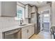Modern kitchen with white cabinets, stainless steel appliances, and a window providing natural light at 1052 Yorktown Dr, Charleston, SC 29412