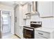 Bright kitchen featuring white cabinets, stainless steel appliances, and white backsplash at 1052 Yorktown Dr, Charleston, SC 29412