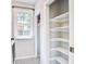 Laundry room area with patterned tile floor, window, and closet space at 1052 Yorktown Dr, Charleston, SC 29412